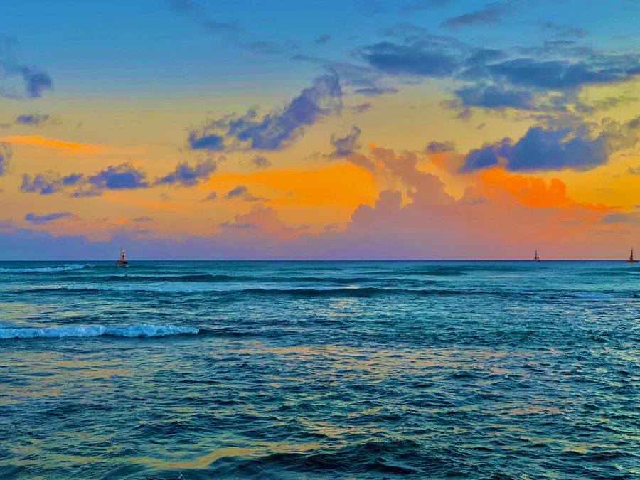 Waikiki ocean sailboats at sunset
